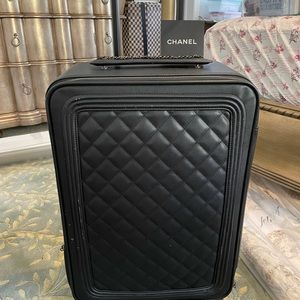 Black leather roller carry on luggage boy bag
